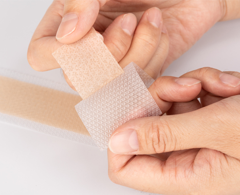 Adhesive tapes and plasters